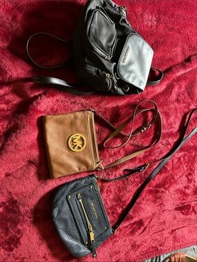 Michael  lot of 3 bags 2 crossbody and one backpack with Gold Hardware
